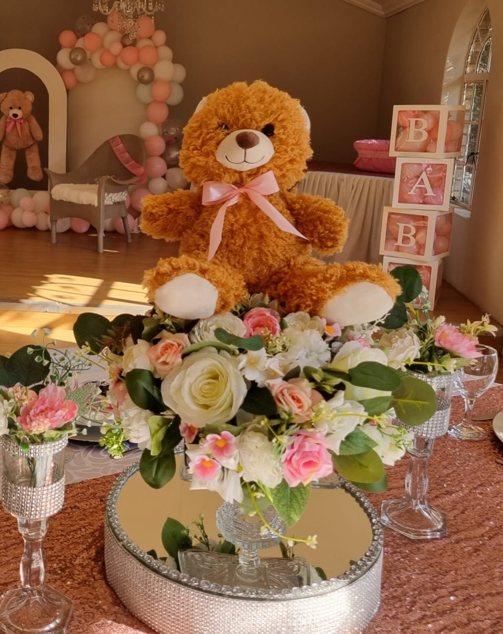 baby shower centerpiece detail with teddy bear and rhinestone stand