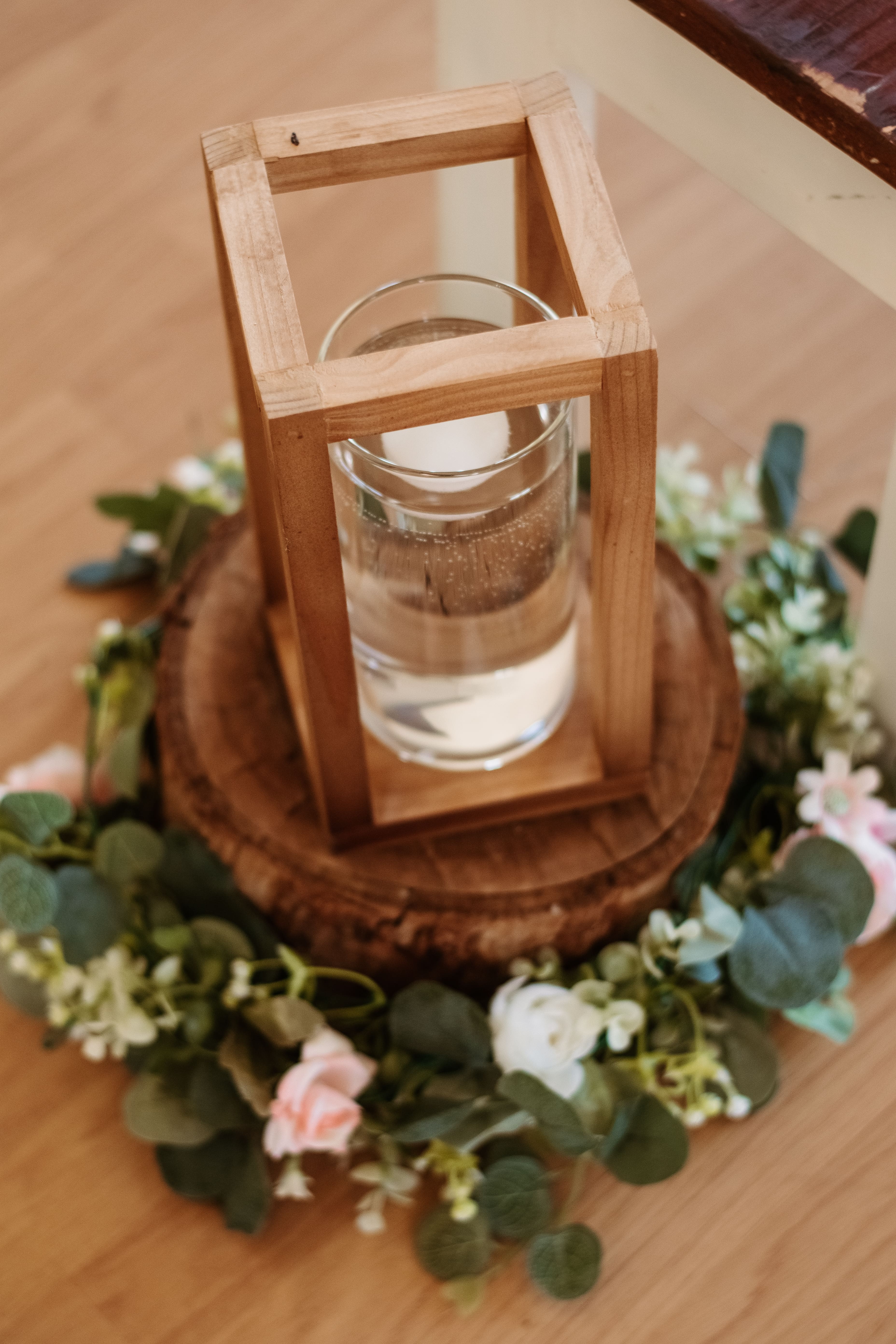 close-up of wooden crate with eucalyptus and heart tags spilling out